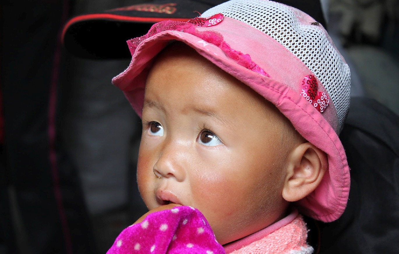 Enfant de l'ethnie NaXi à Lijiang Yunnan - Chine